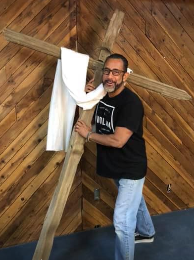 Pastor Ruben Holding the Cross